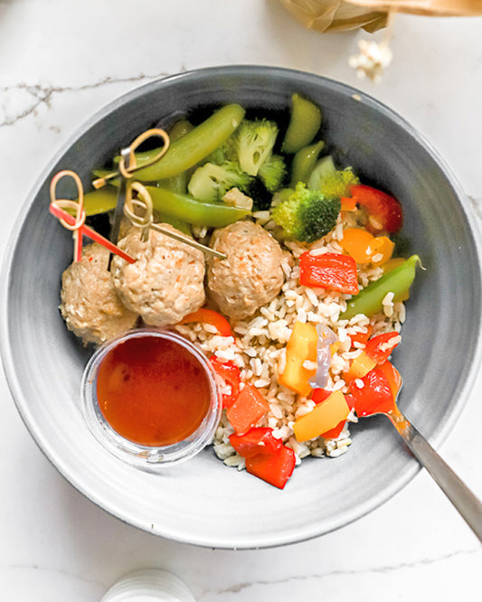 General Tsao Style Pork Balls Over Mixed Veggies & Rice Noodles